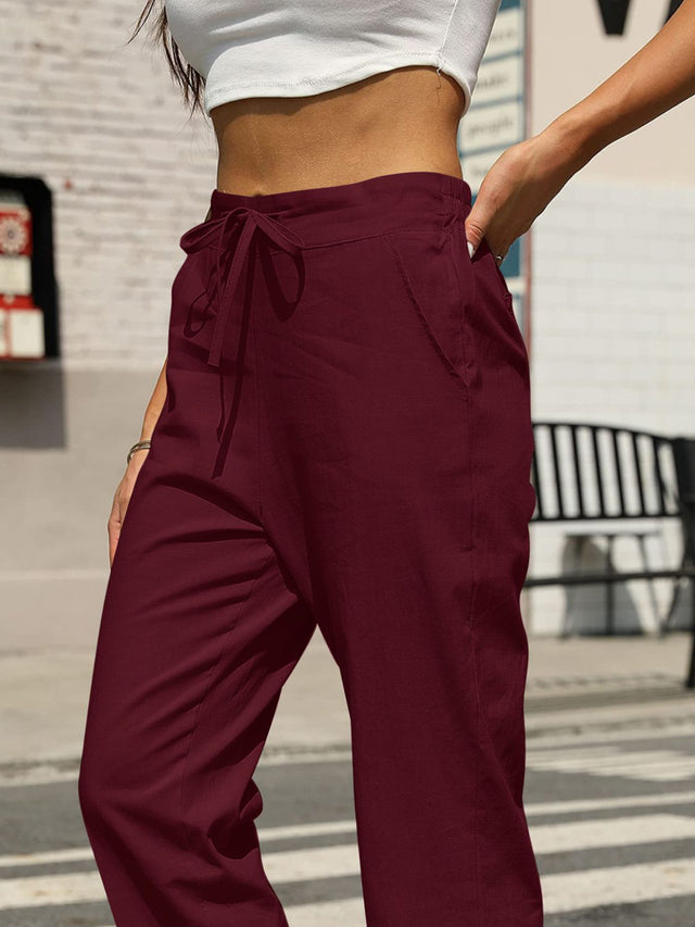 Elastic waist tapered pants, opaque.