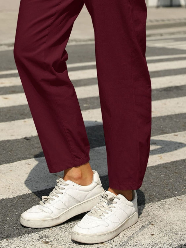Elastic waist tapered pants, opaque.