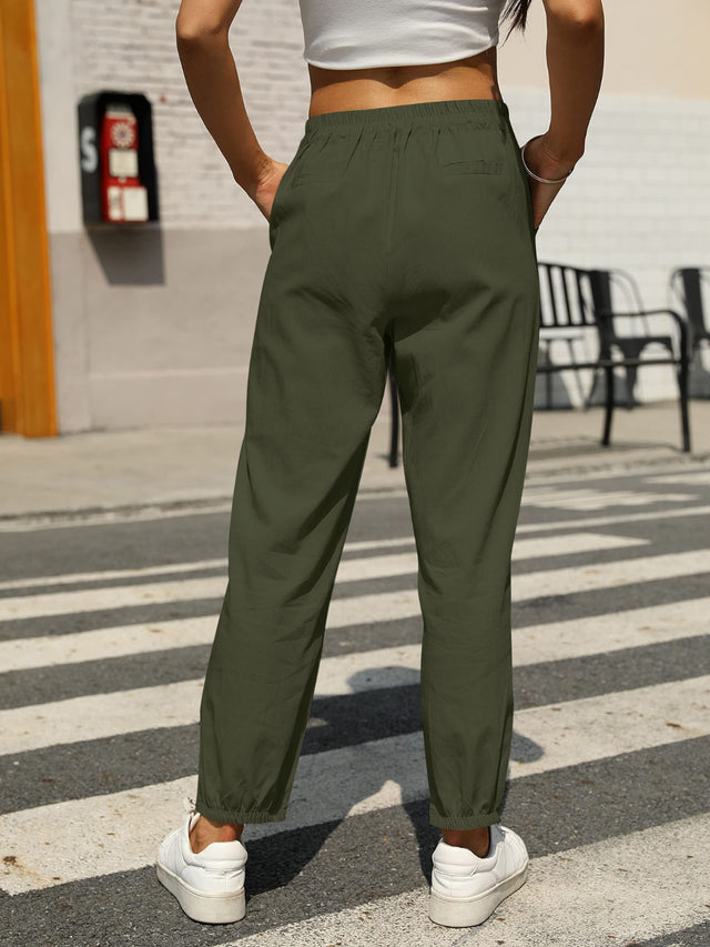 Elastic waist tapered pants, opaque.