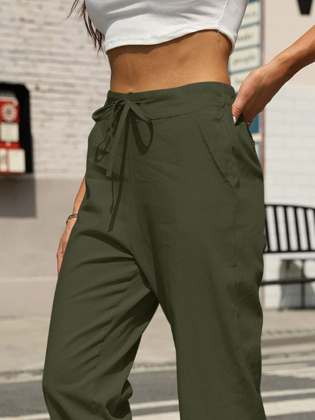 Elastic waist tapered pants, opaque.