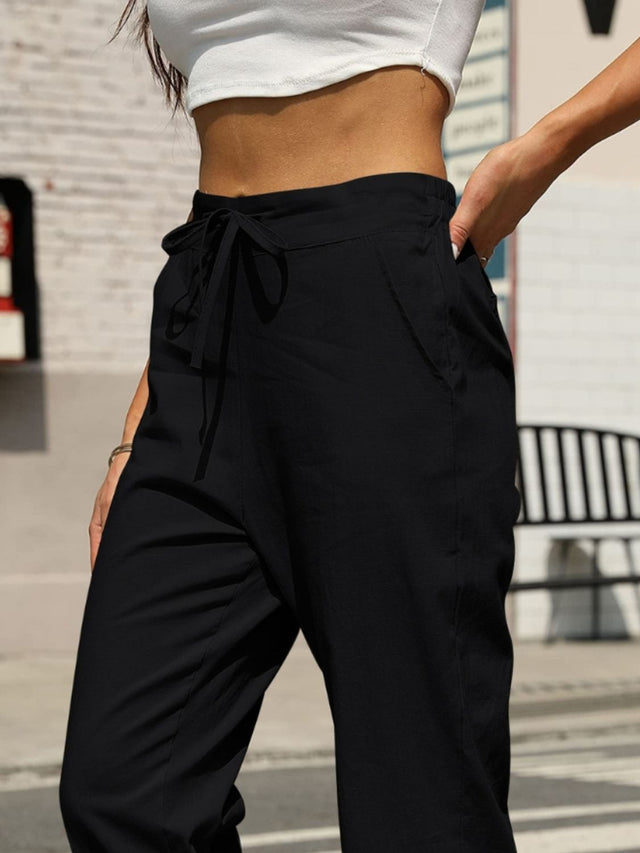 Elastic waist tapered pants, opaque.