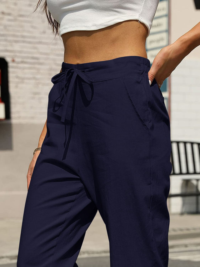 Elastic waist tapered pants, opaque.