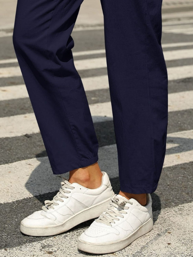 Elastic waist tapered pants, opaque.