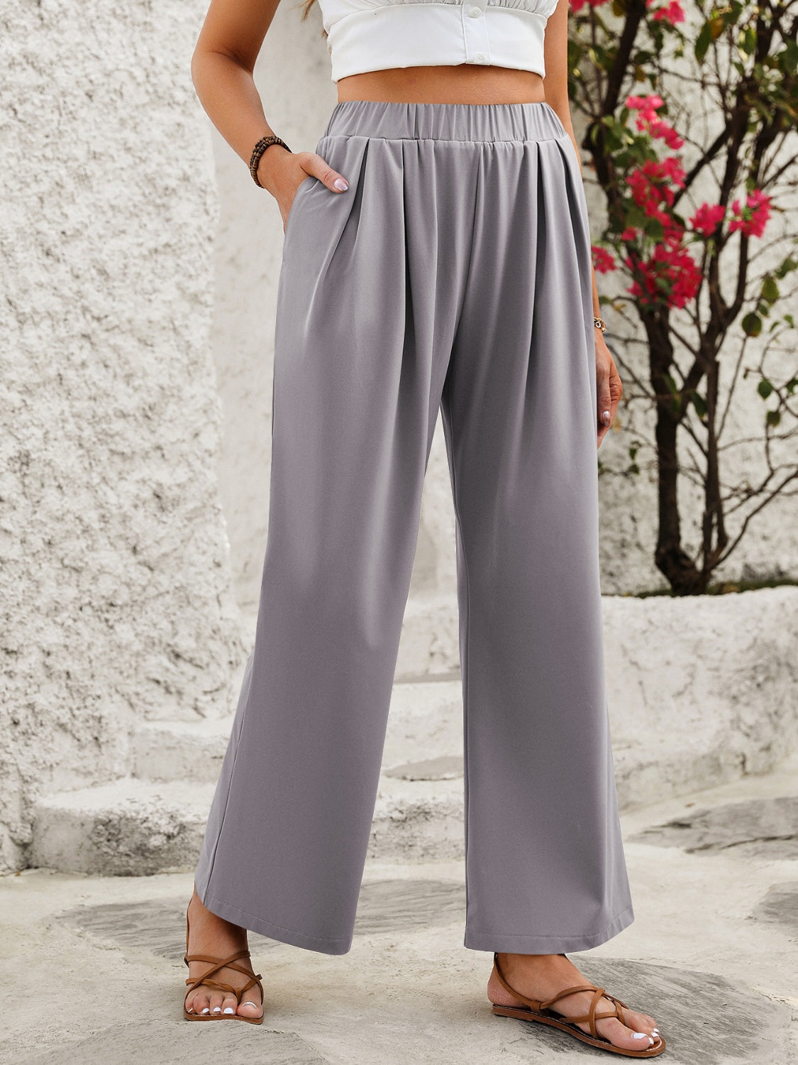 Elastic waist wide leg pants with pockets, opaque.
