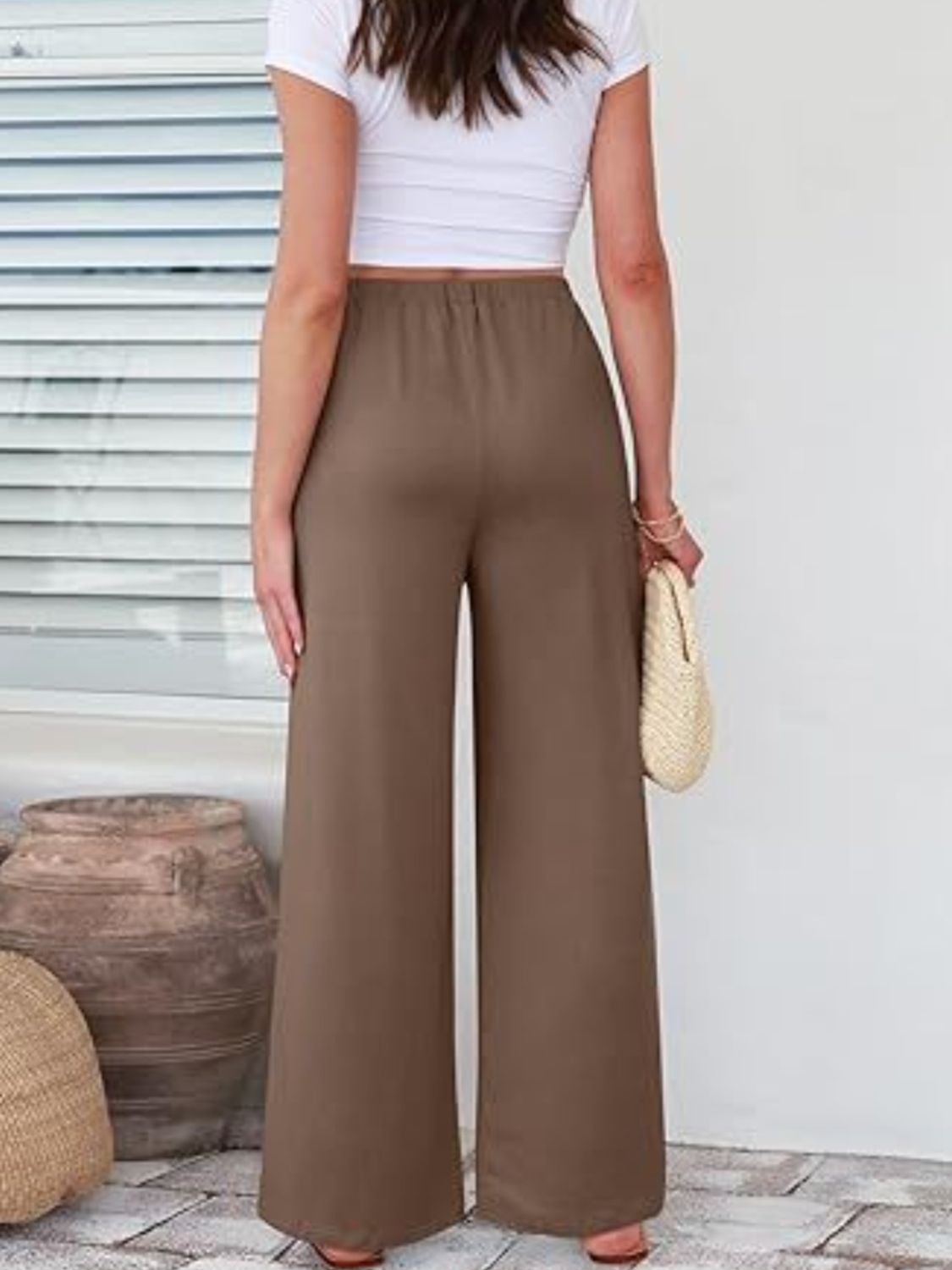 Elastic waist wide leg pants with pockets, opaque.