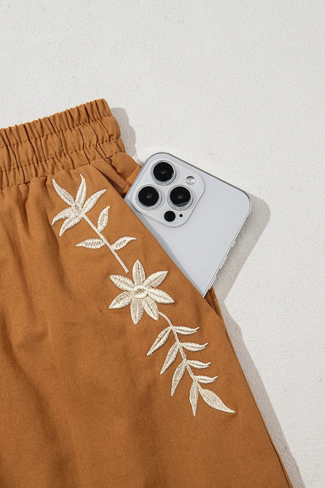 Embroidered boho tasseled drawstring elastic waist casual shorts.
