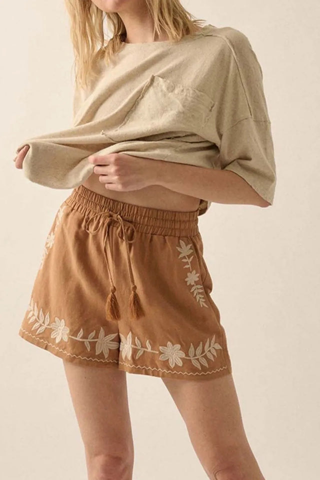 Embroidered boho tasseled drawstring elastic waist casual shorts.