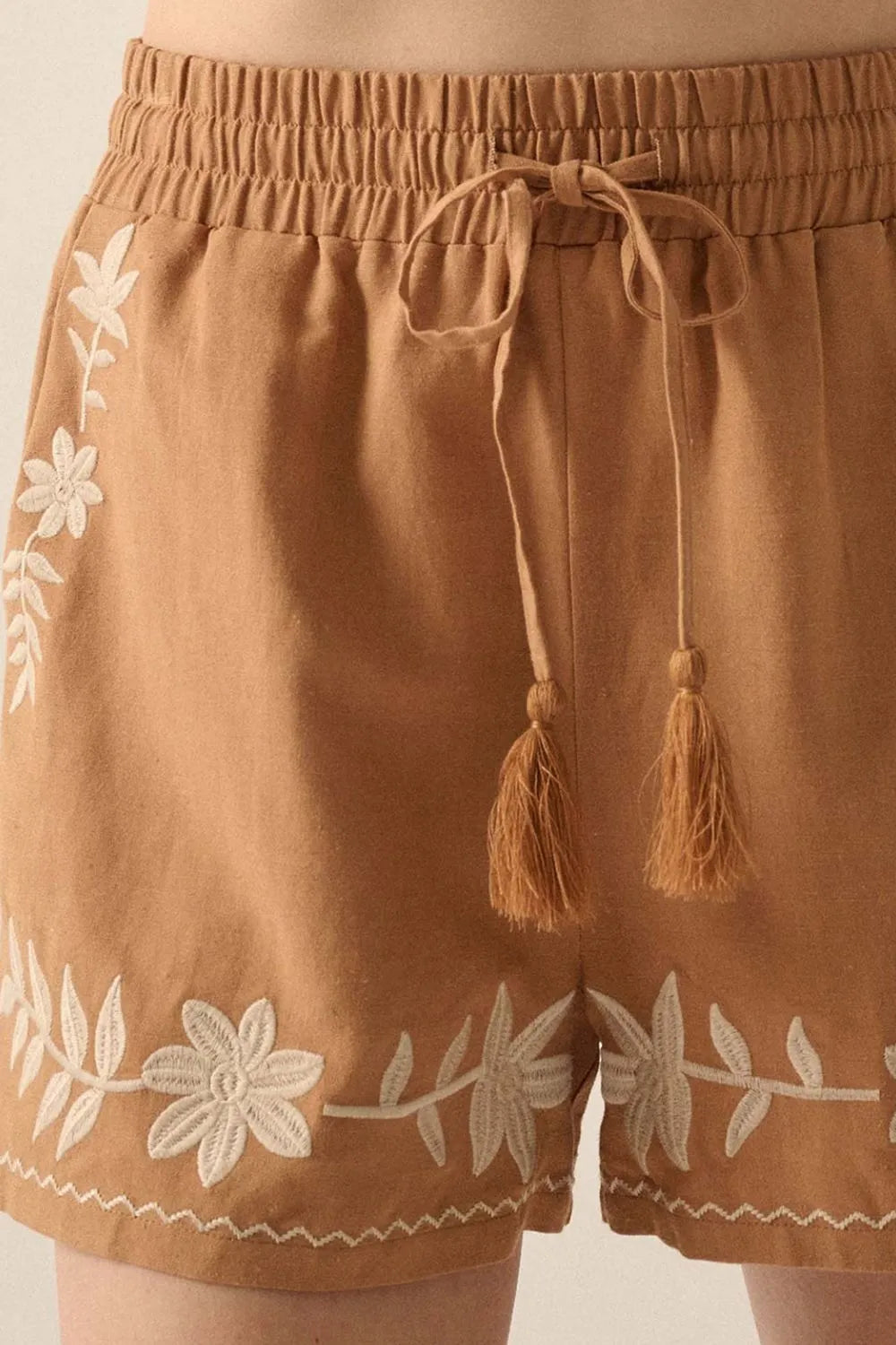 Embroidered boho tasseled drawstring elastic waist casual shorts.