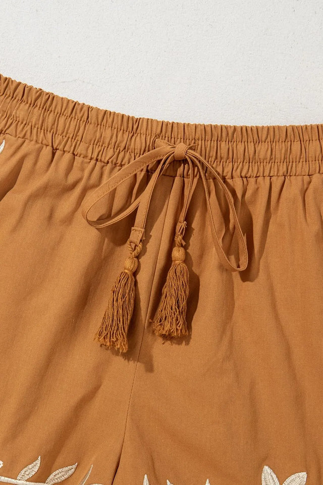 Embroidered boho tasseled drawstring elastic waist casual shorts.