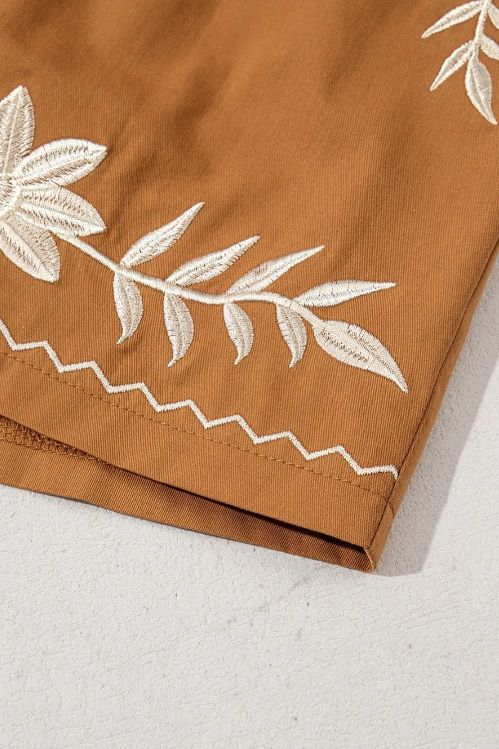 Embroidered boho tasseled drawstring elastic waist casual shorts.