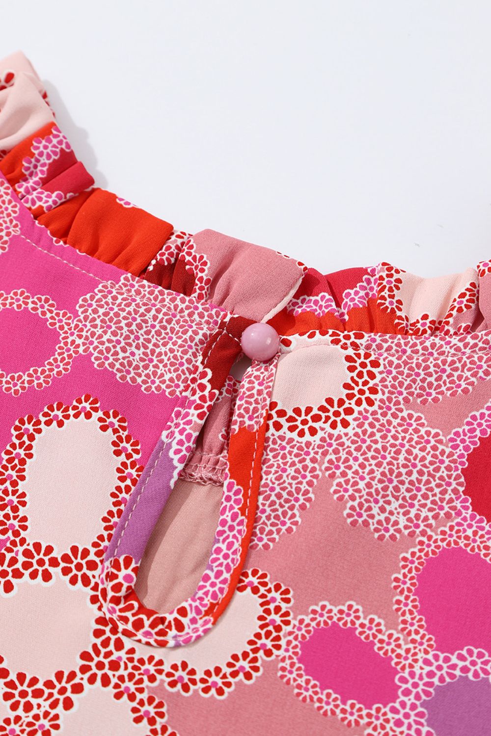Embroidered detail floral ruffle cap sleeve blouse with frill.