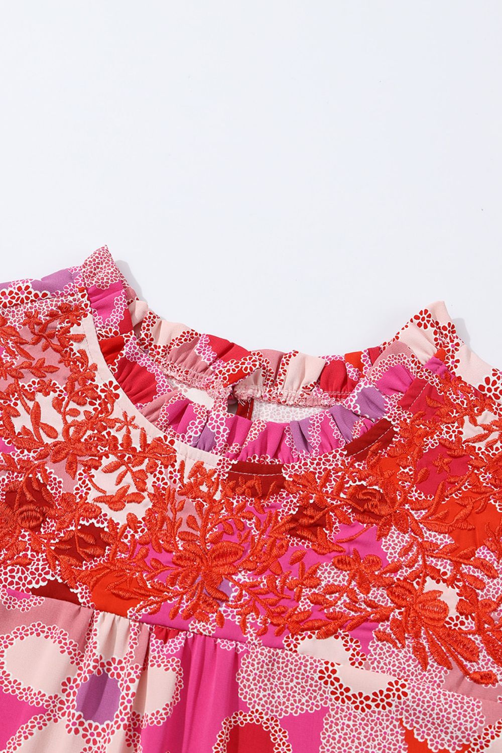 Embroidered detail floral ruffle cap sleeve blouse with frill.