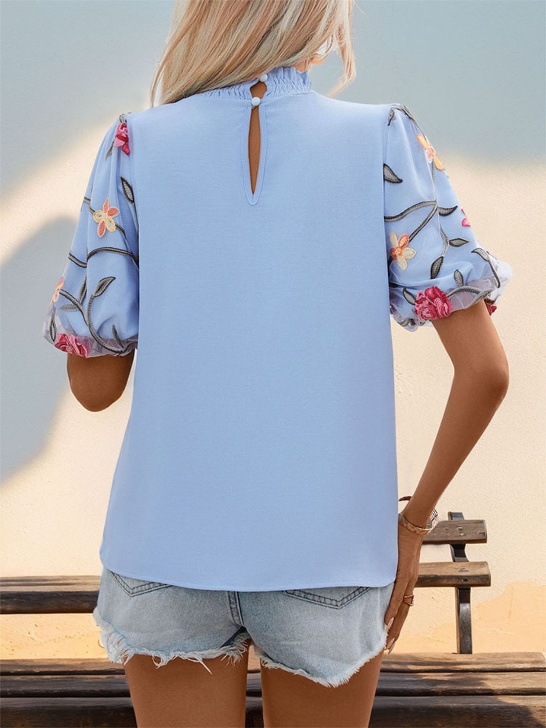 Perfee embroidered mock neck puff sleeve blouse.