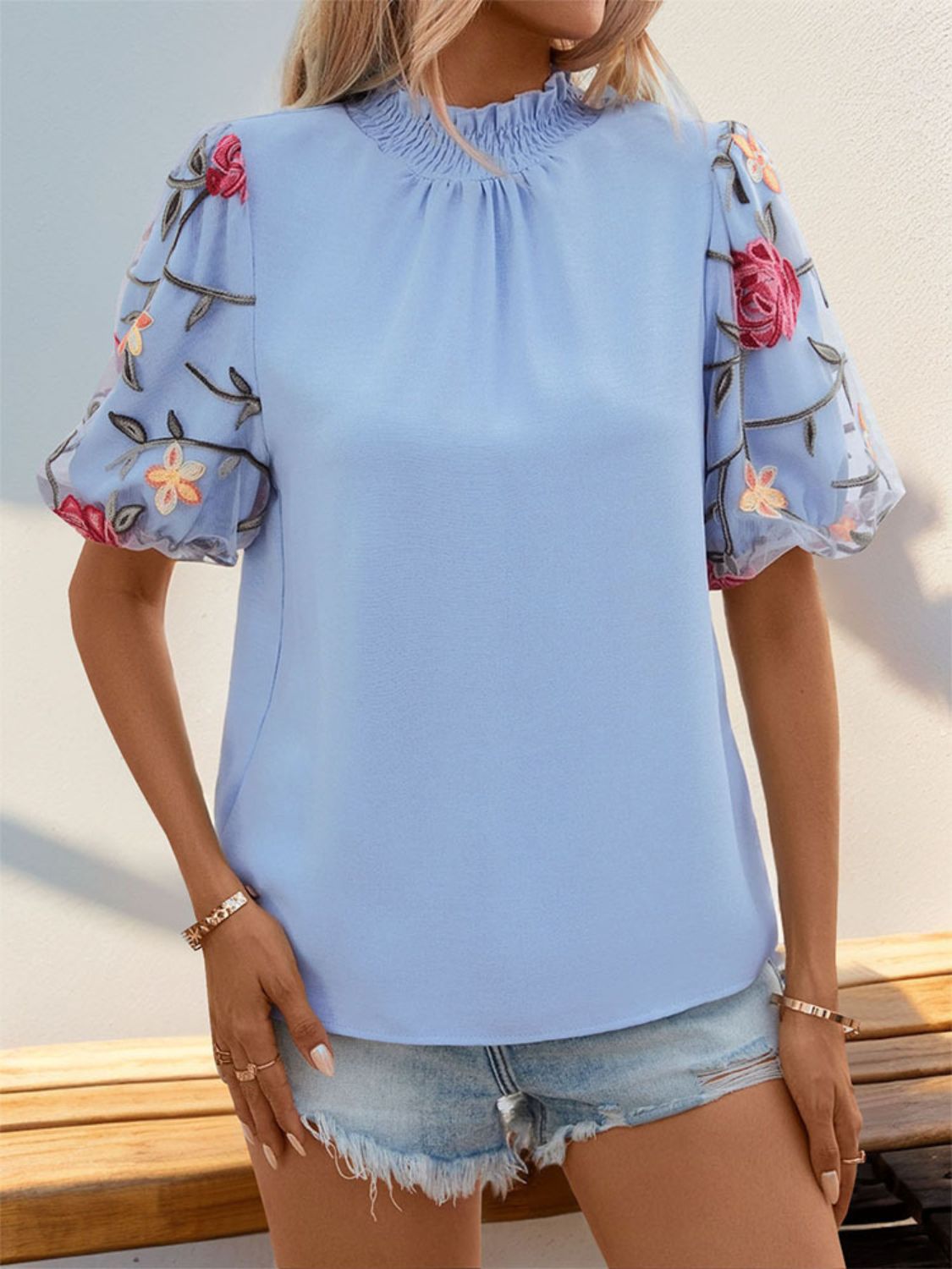 Perfee embroidered mock neck puff sleeve blouse.