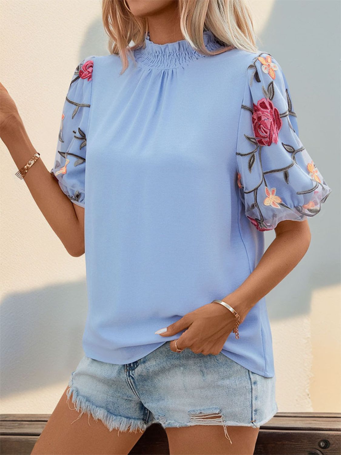 Perfee embroidered mock neck puff sleeve blouse.
