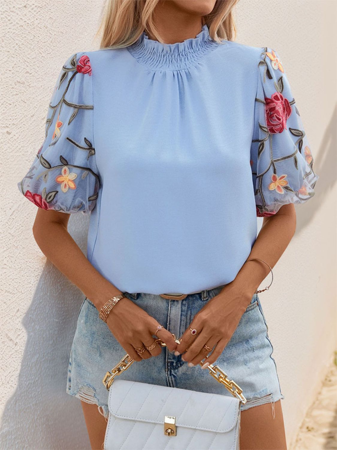 Perfee embroidered mock neck puff sleeve blouse.