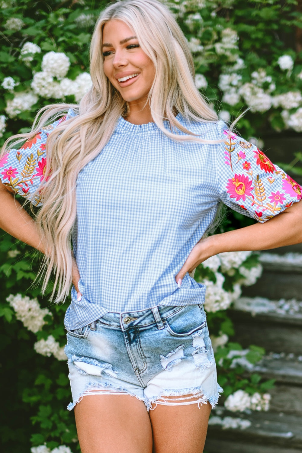 Embroidered plaid round neck short sleeve blouse.