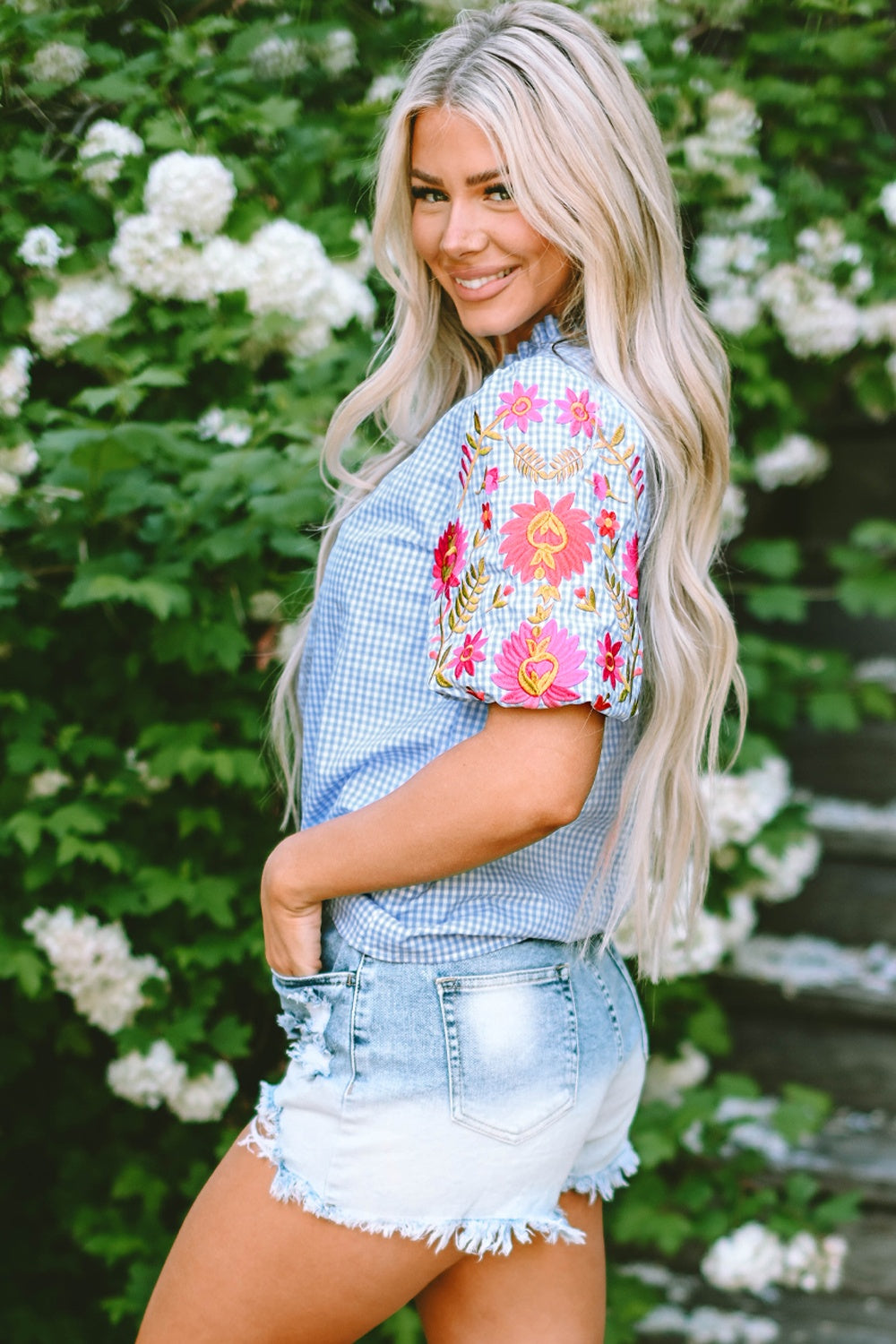 Embroidered plaid round neck short sleeve blouse.