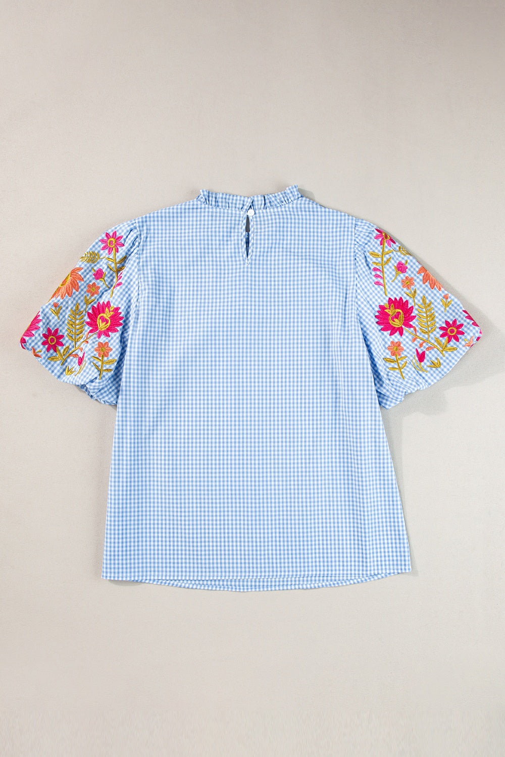 Embroidered plaid round neck short sleeve blouse.