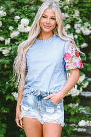 Embroidered plaid round neck short sleeve blouse.