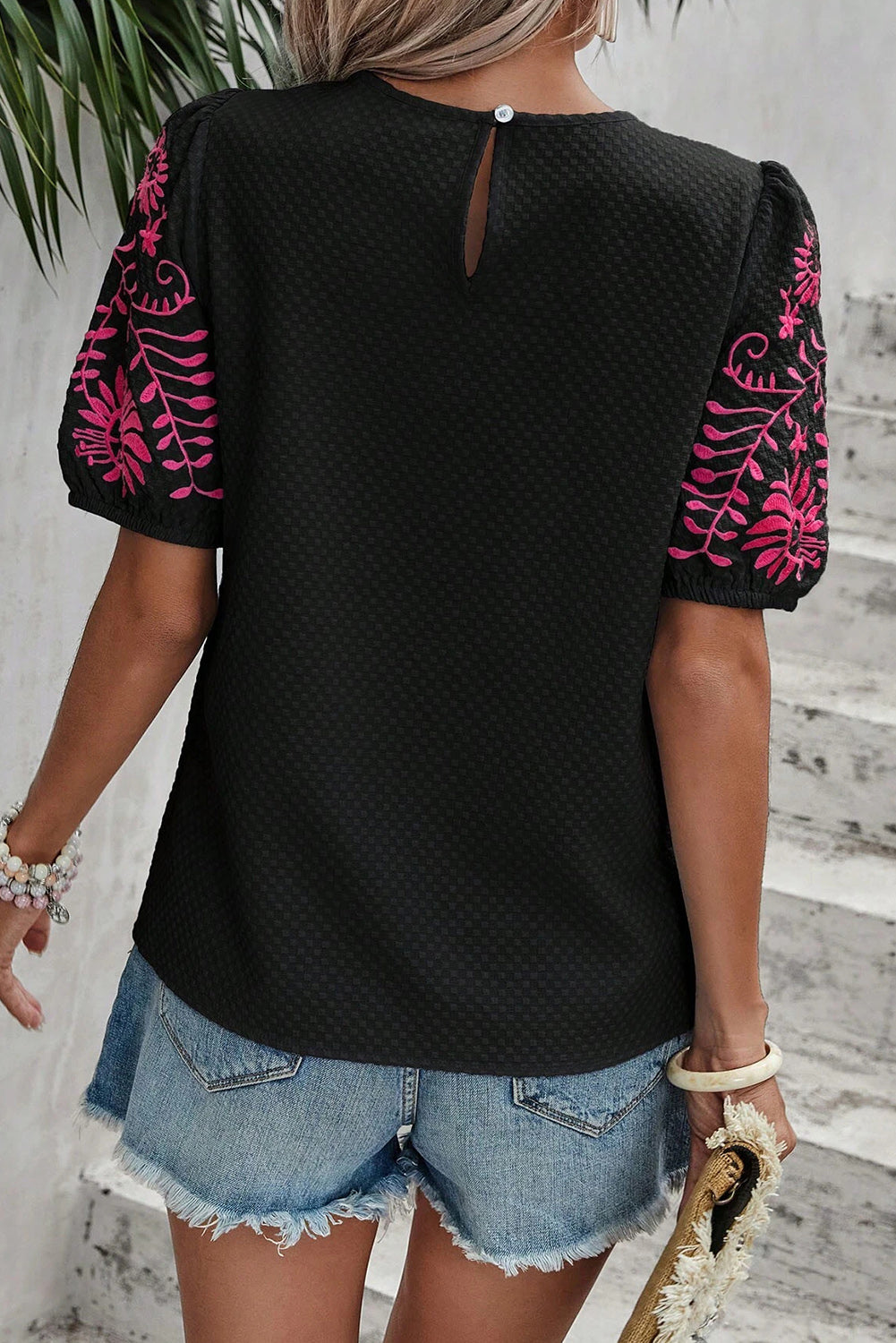 Embroidered round neck short sleeve blouse.