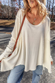 Exposed seam round neck long sleeve blouse.
