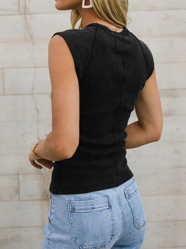 Round neck tank top with exposed seam details.