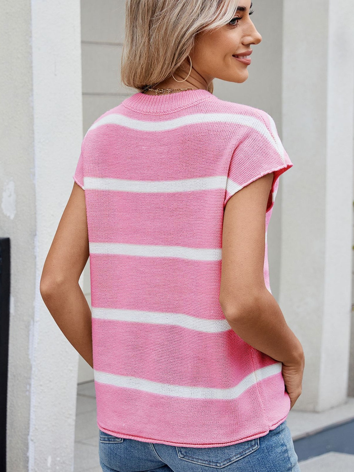 Exposed seam striped round neck knit top.