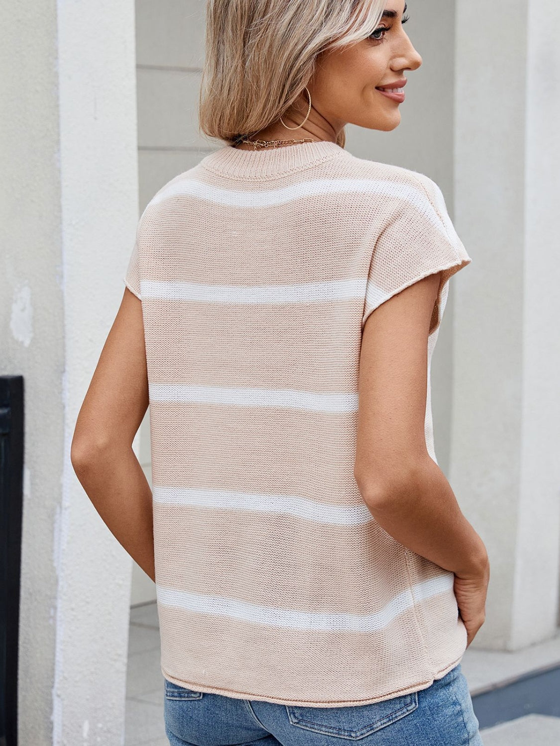 Exposed seam striped round neck knit top.