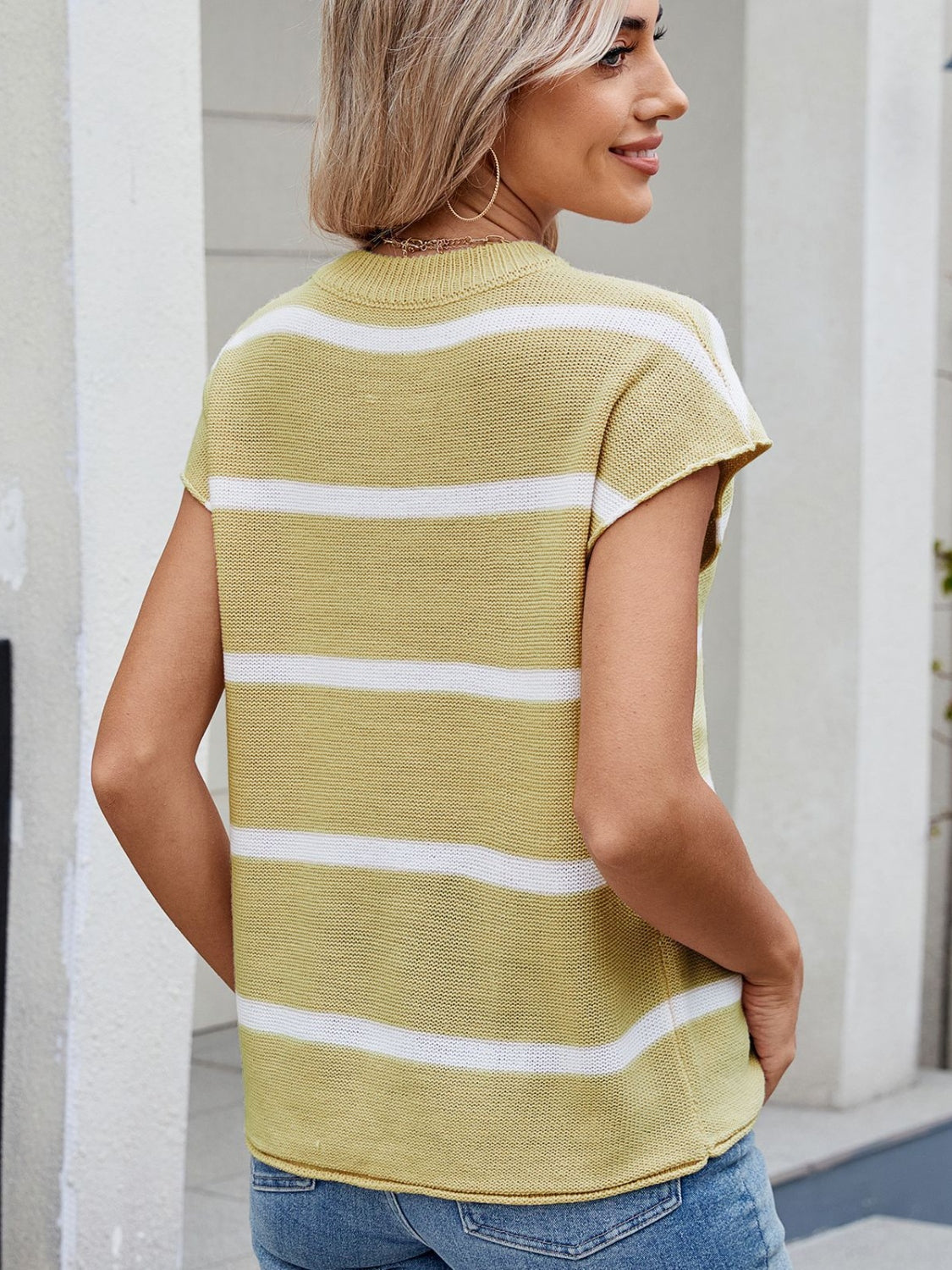 Exposed seam striped round neck knit top.