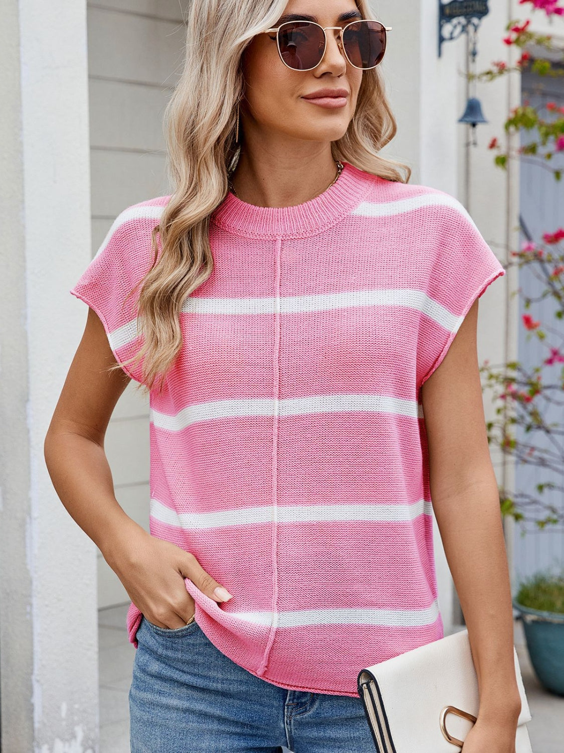 Exposed seam striped round neck knit top.