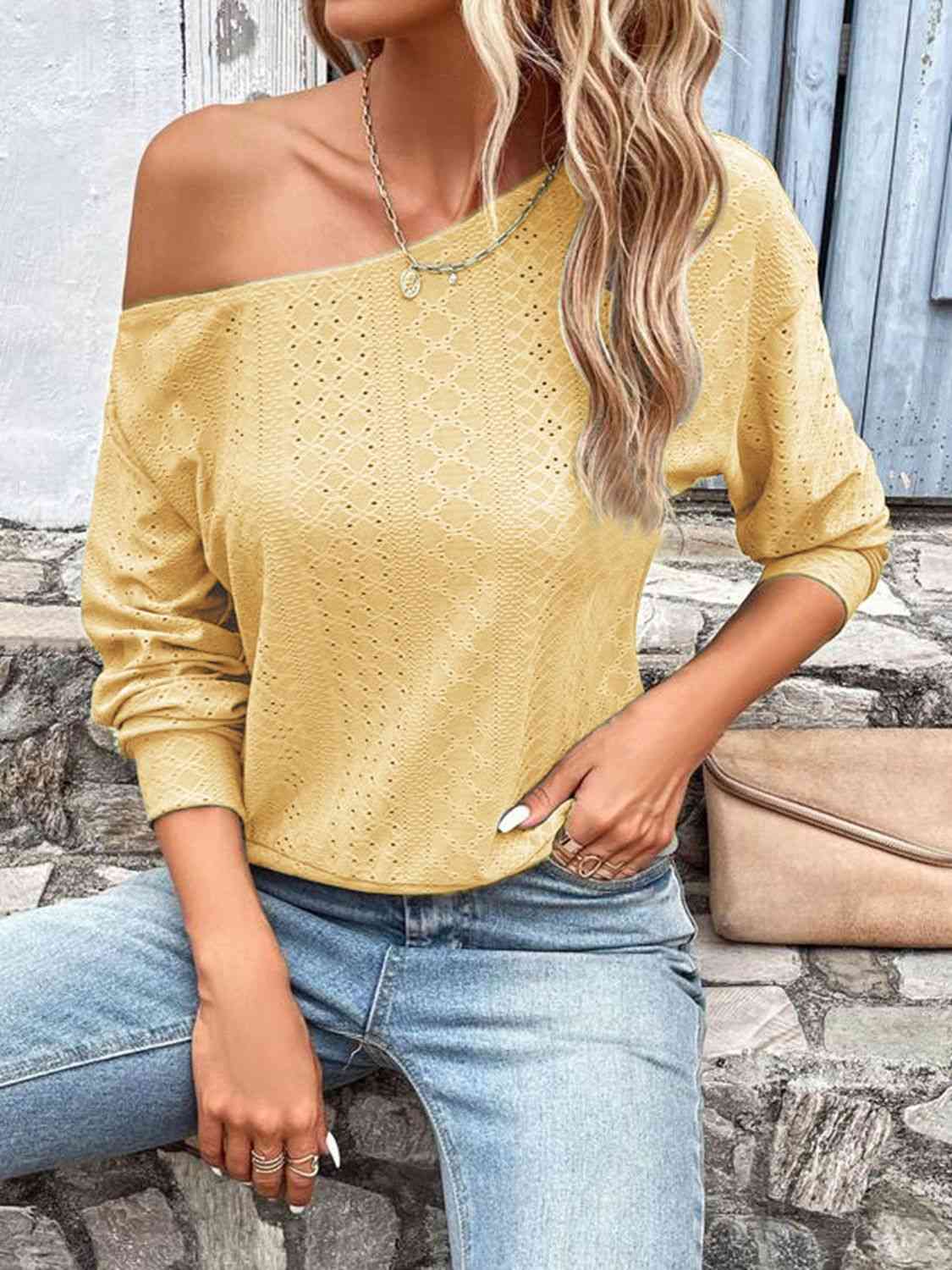 Eyelet dropped shoulder blouse.
