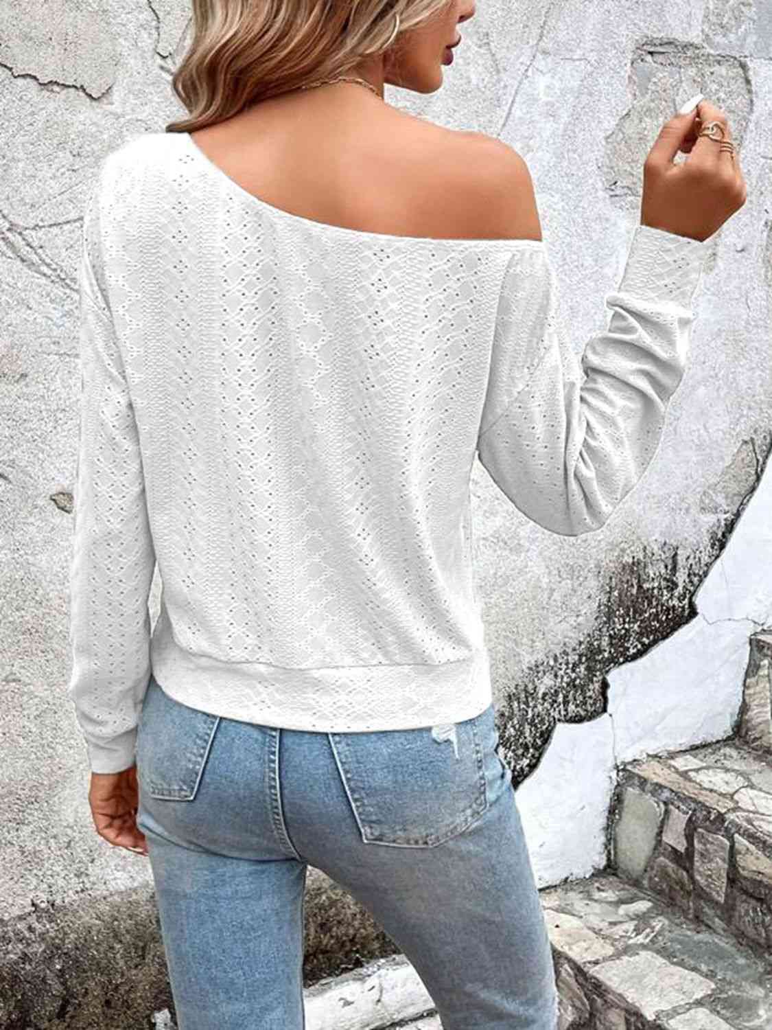 Eyelet dropped shoulder blouse.