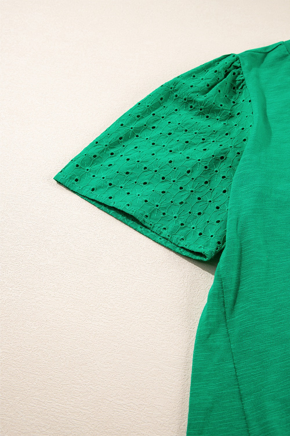 Eyelet embroidered patchwork top.