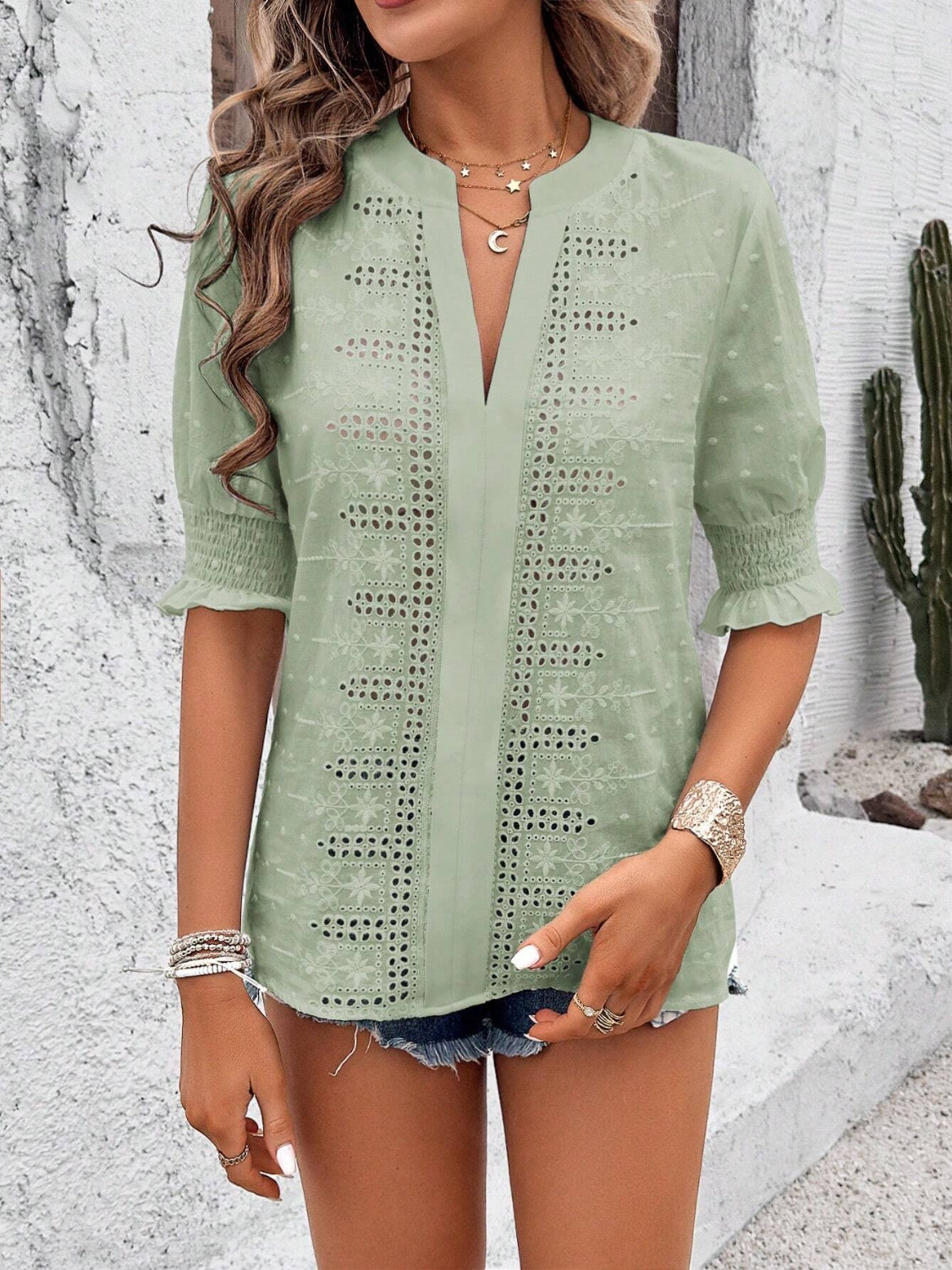 Eyelet notched flounce sleeve blouse.