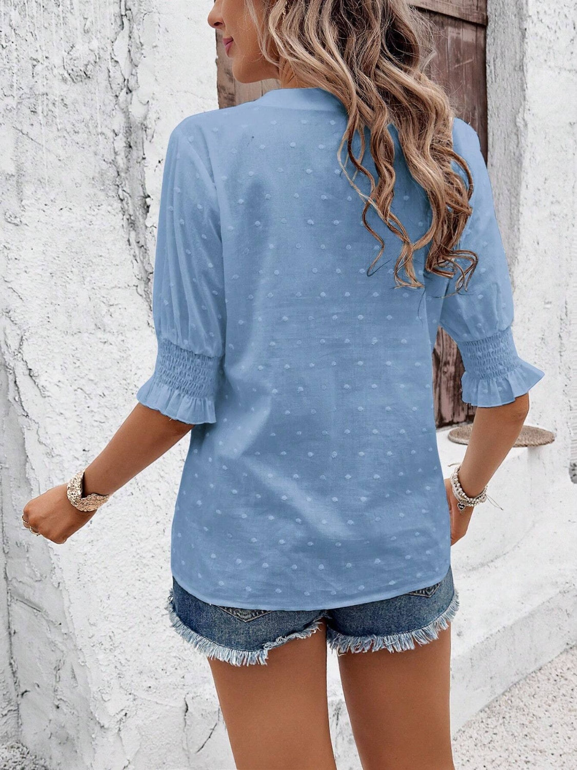 Eyelet notched flounce sleeve blouse.