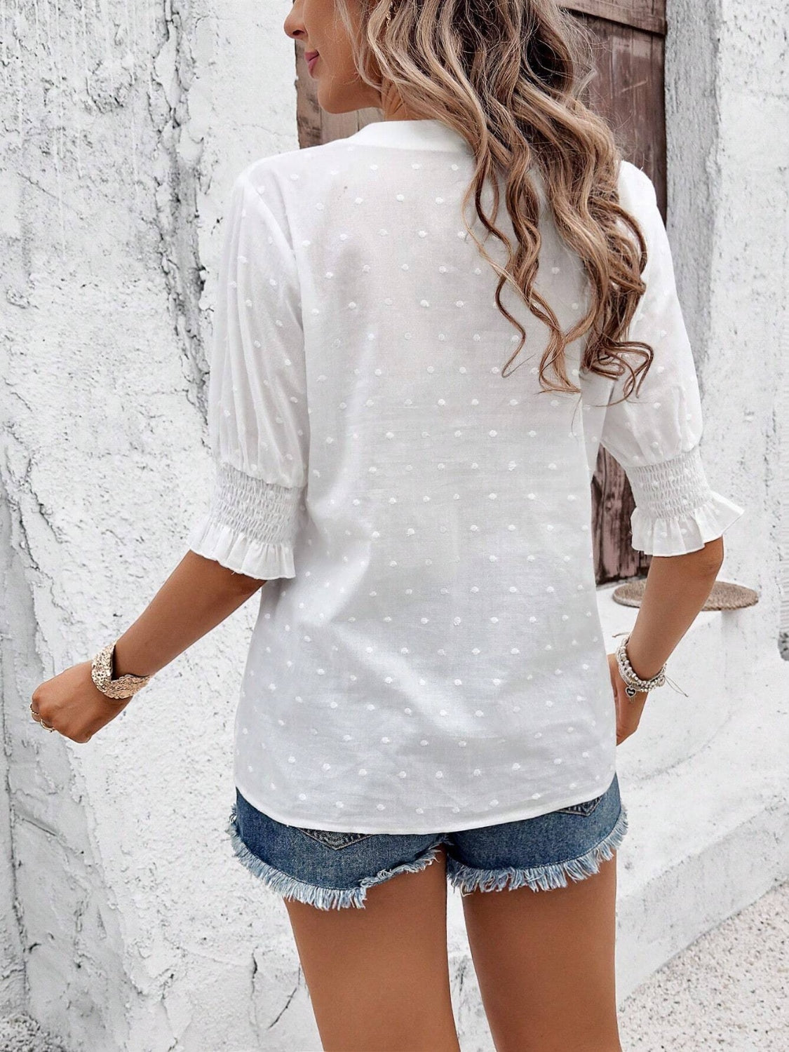 Eyelet notched flounce sleeve blouse.
