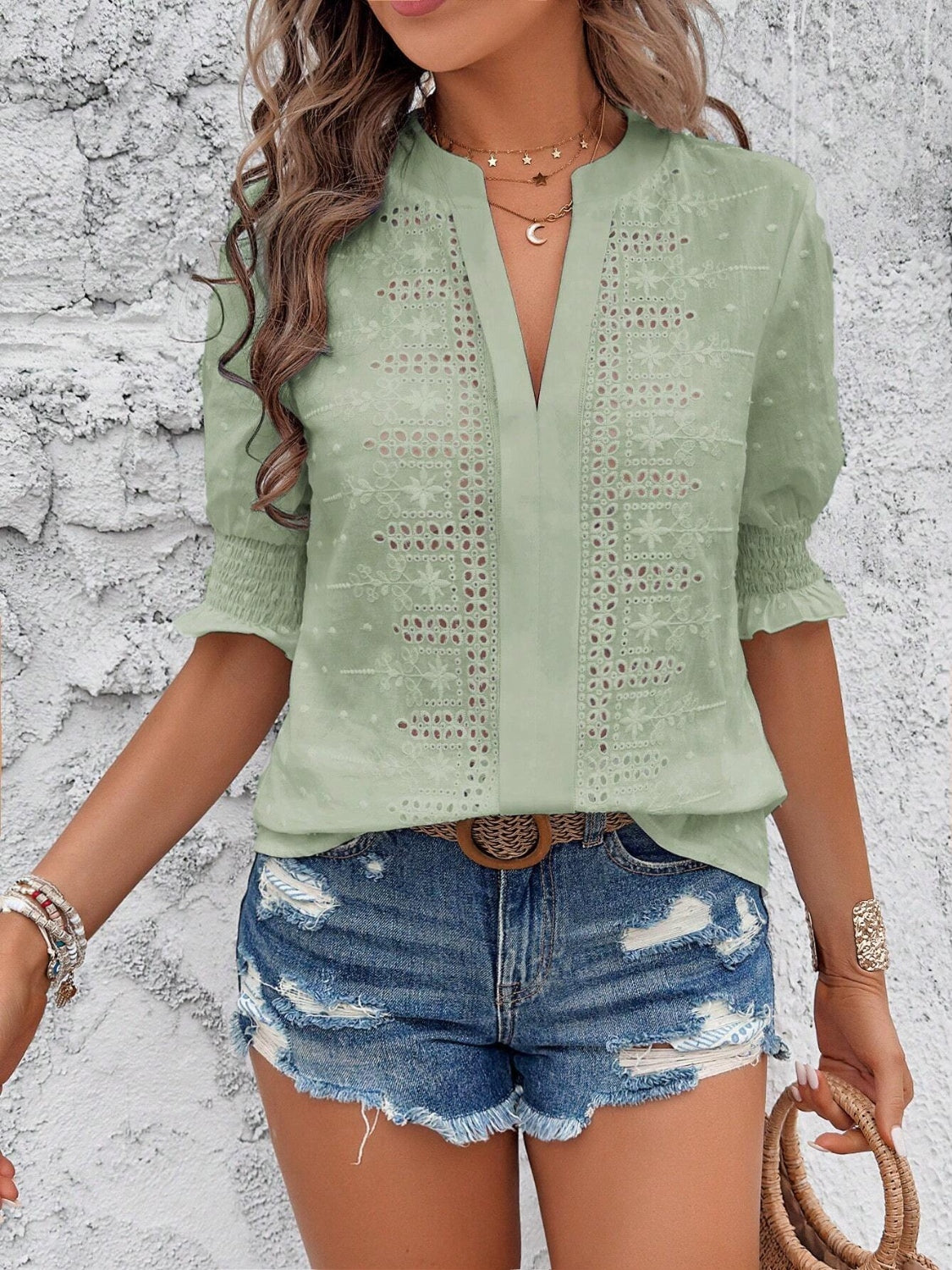 Eyelet notched flounce sleeve blouse.