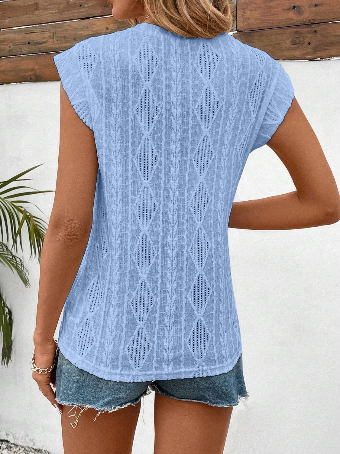 Eyelet round neck cap sleeve top.