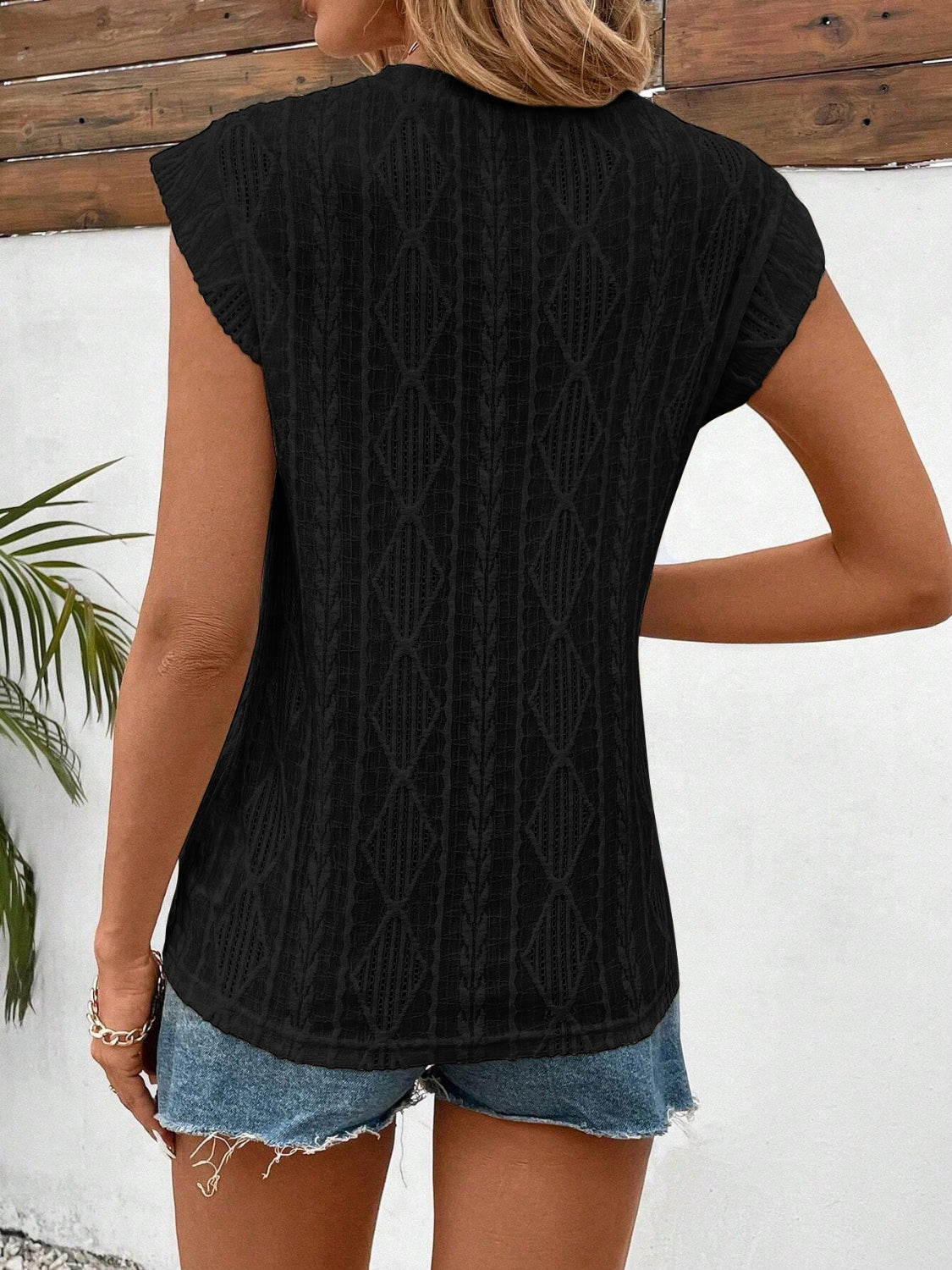 Eyelet round neck cap sleeve top.