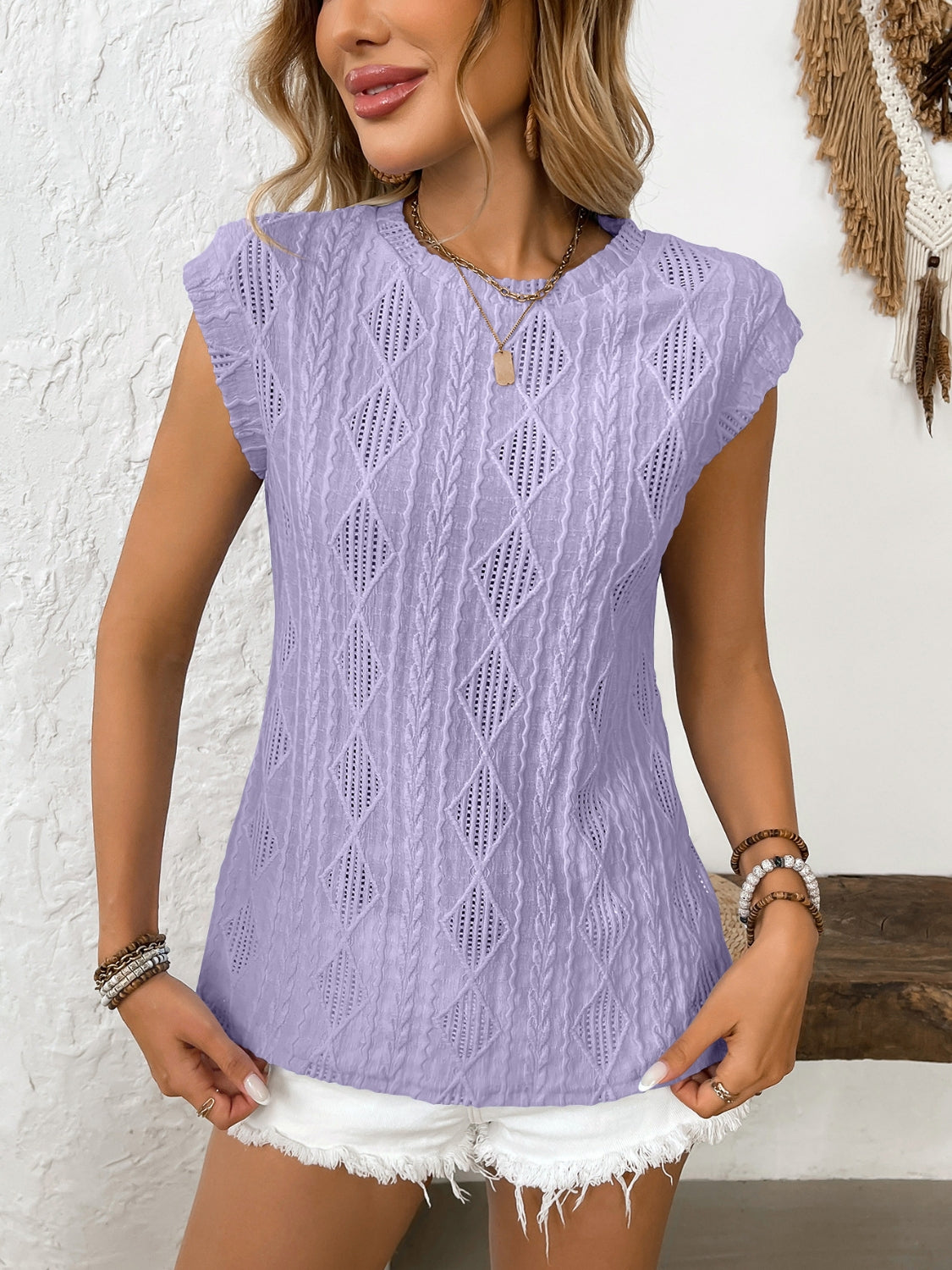 Eyelet round neck cap sleeve top.