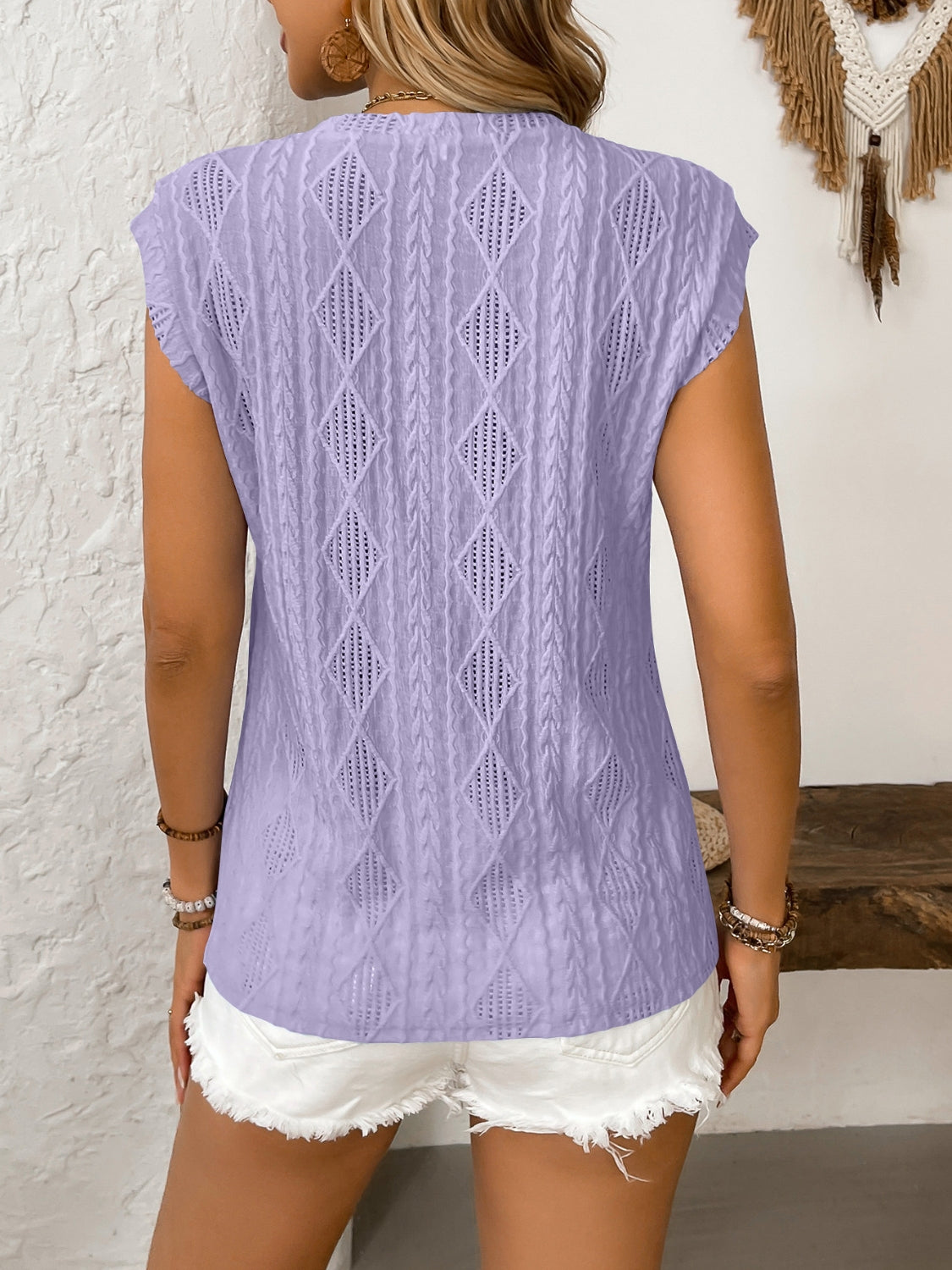 Eyelet round neck cap sleeve top.