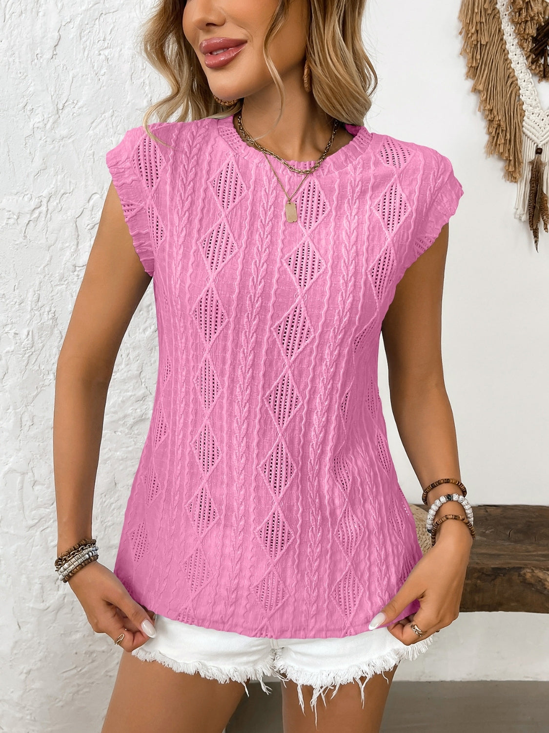 Eyelet round neck cap sleeve top.