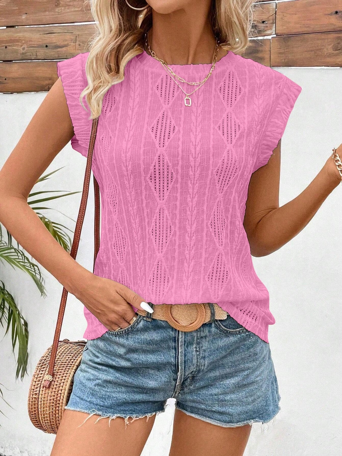 Eyelet round neck cap sleeve top.