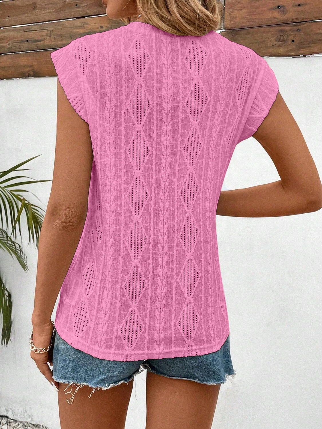 Eyelet round neck cap sleeve top.