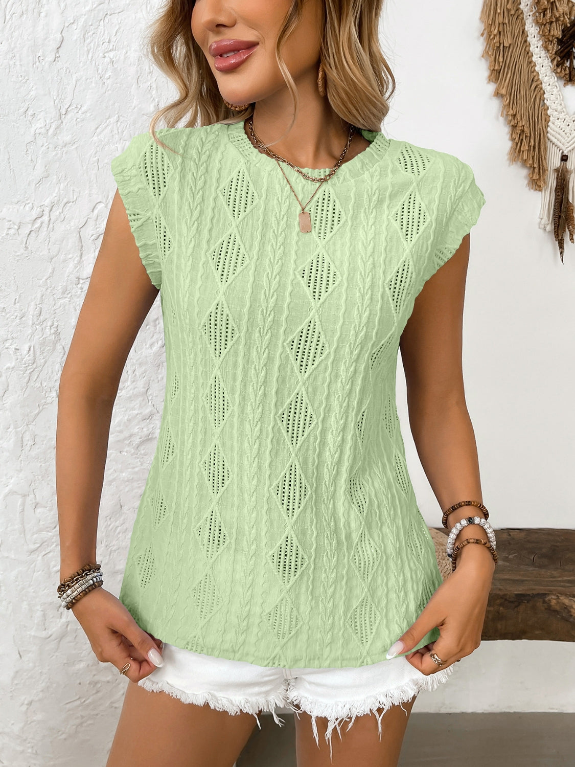 Eyelet round neck cap sleeve top.