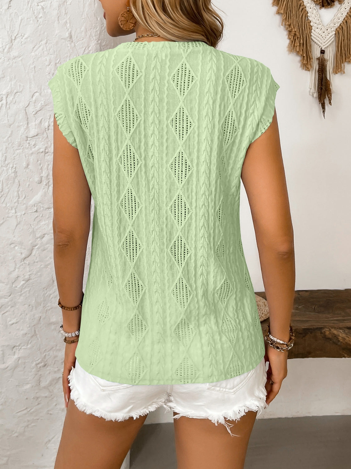 Eyelet round neck cap sleeve top.