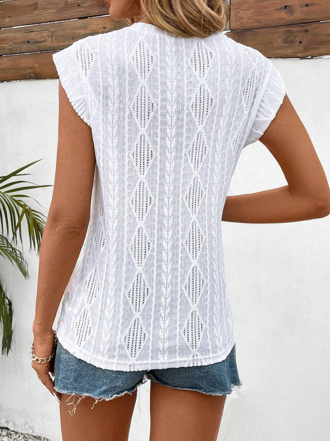 Eyelet round neck cap sleeve top.