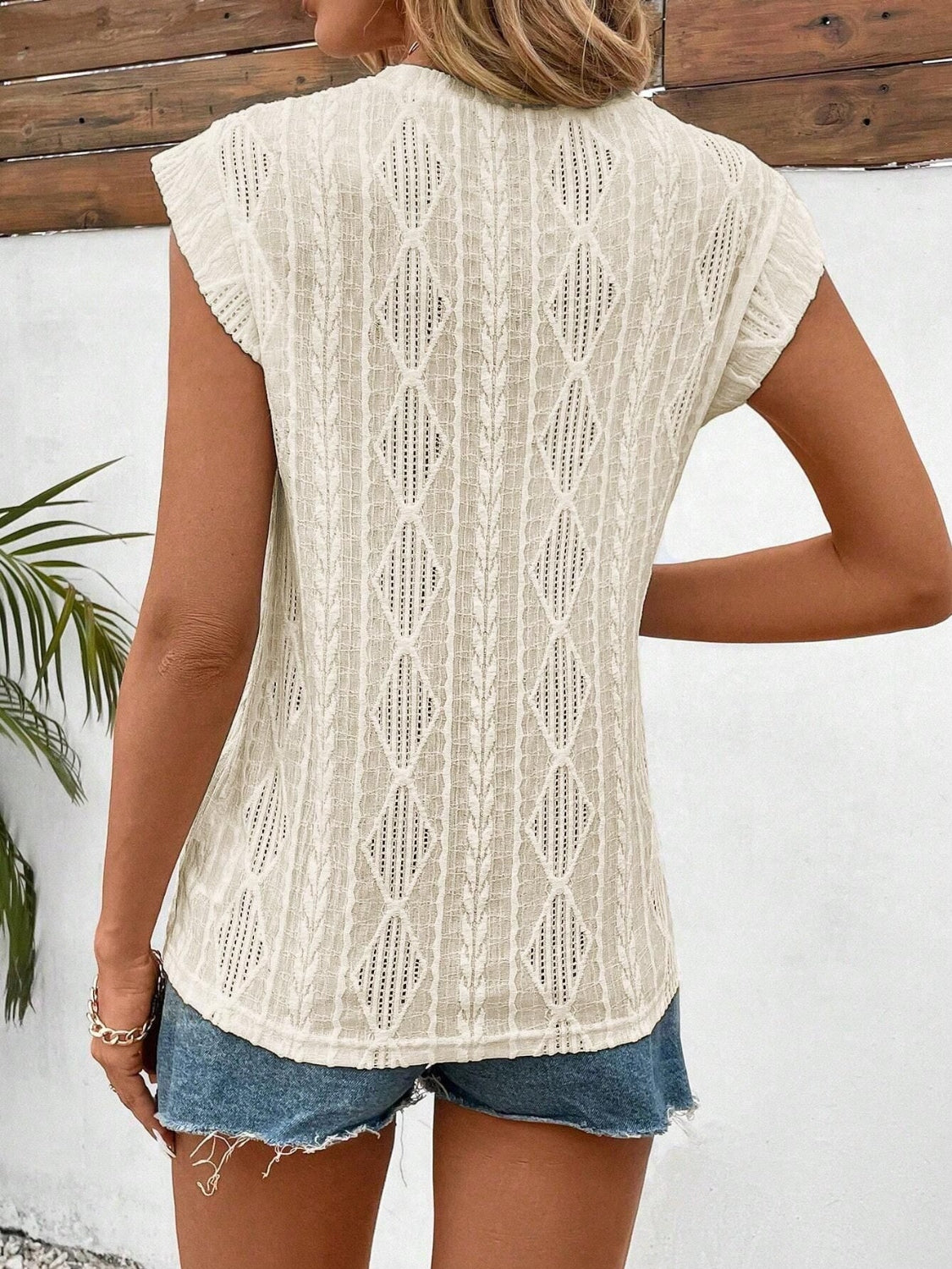 Eyelet round neck cap sleeve top.