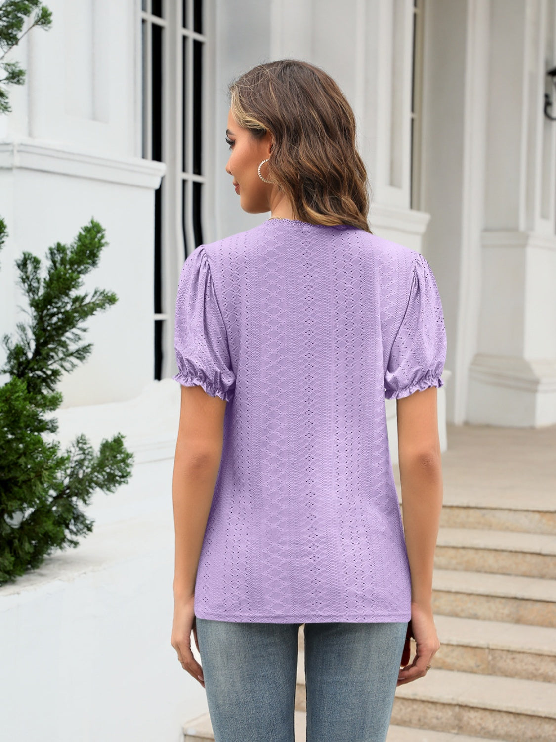 Eyelet round neck short sleeve blouse with frill.